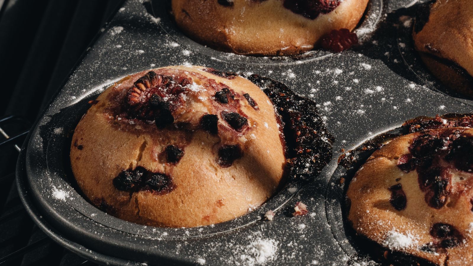 Freshly baked muffins cooling in a muffin tin ready for air fryer cups comparison