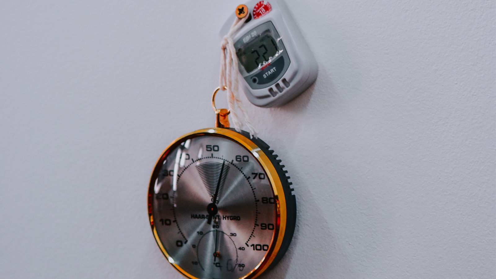 Analog and digital kitchen thermometers displayed side by side for comparison