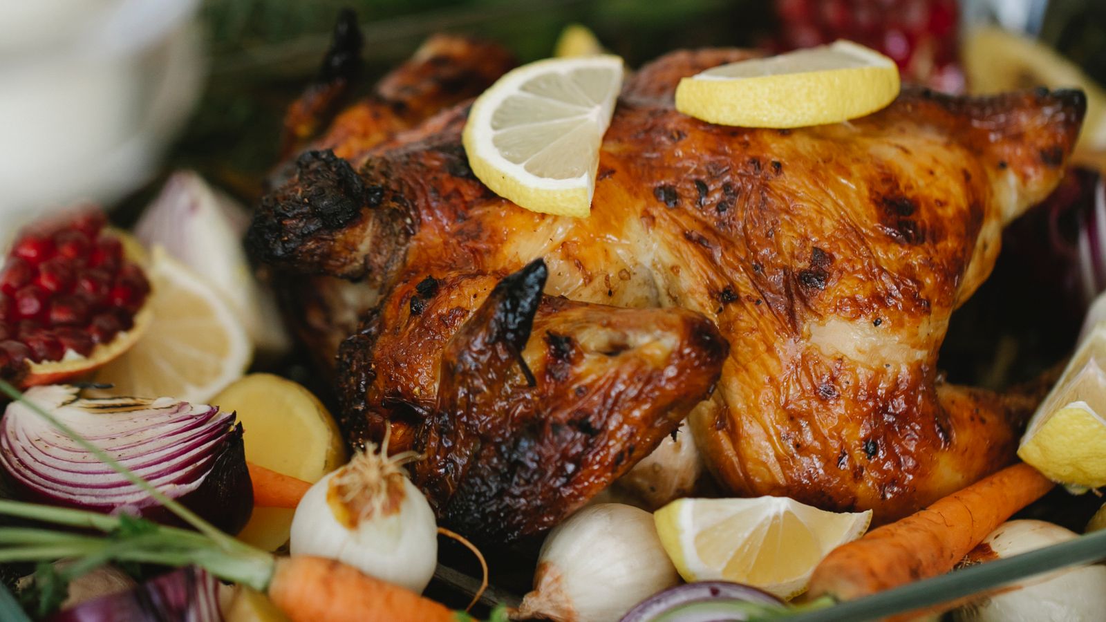 Broiled food browning evenly inside an air fryer oven basket