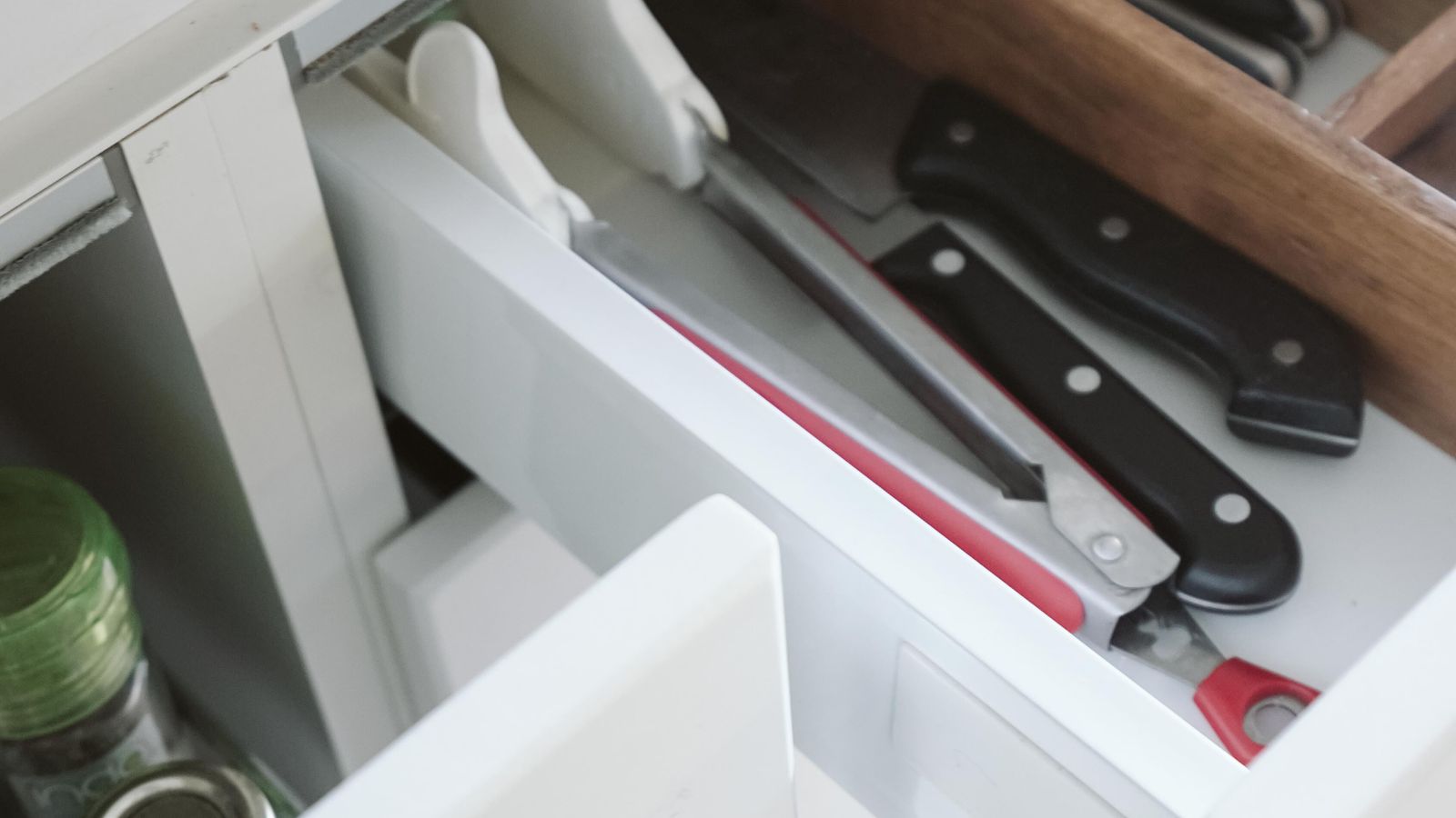 Organized kitchen drawer with air fryer accessories neatly arranged