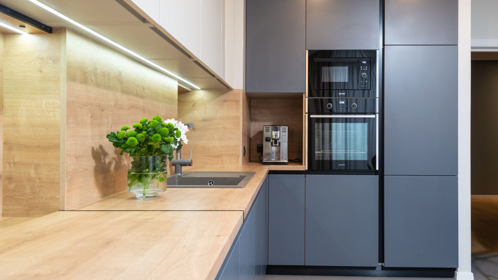 Organized kitchen countertop with cooking appliances arranged for a compact cooking station
