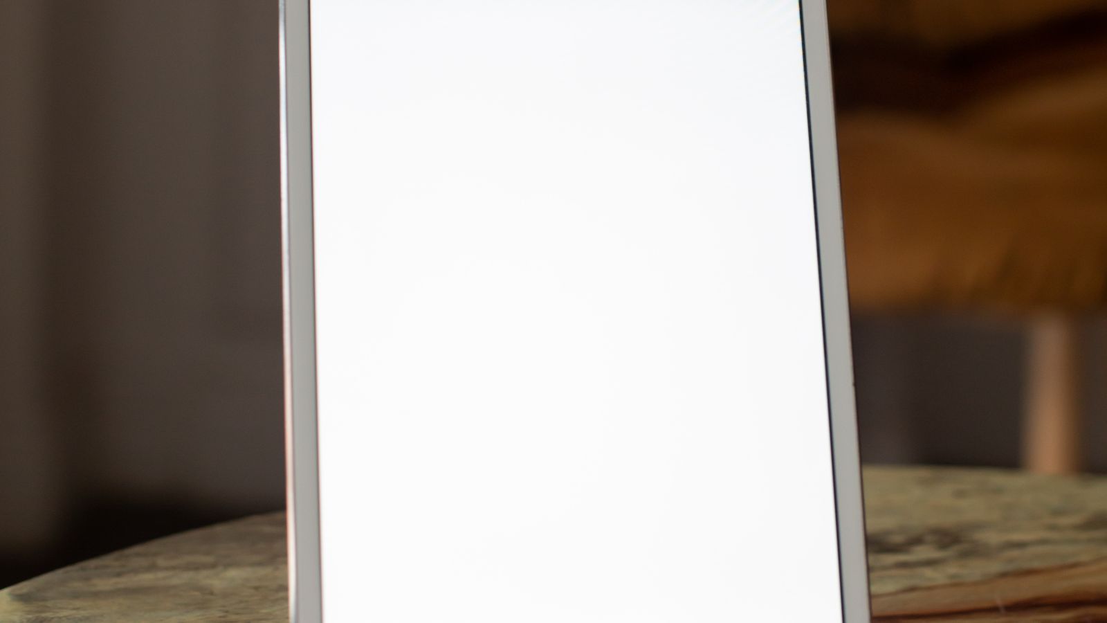 Tablet propped on a stand displaying a recipe next to kitchen prep area