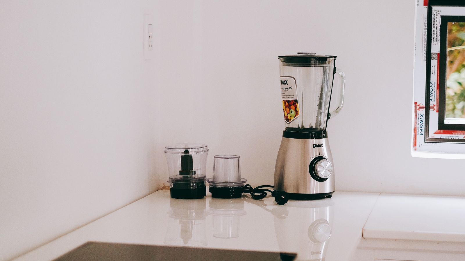 Compact air fryer tucked into a corner kitchen counter setup