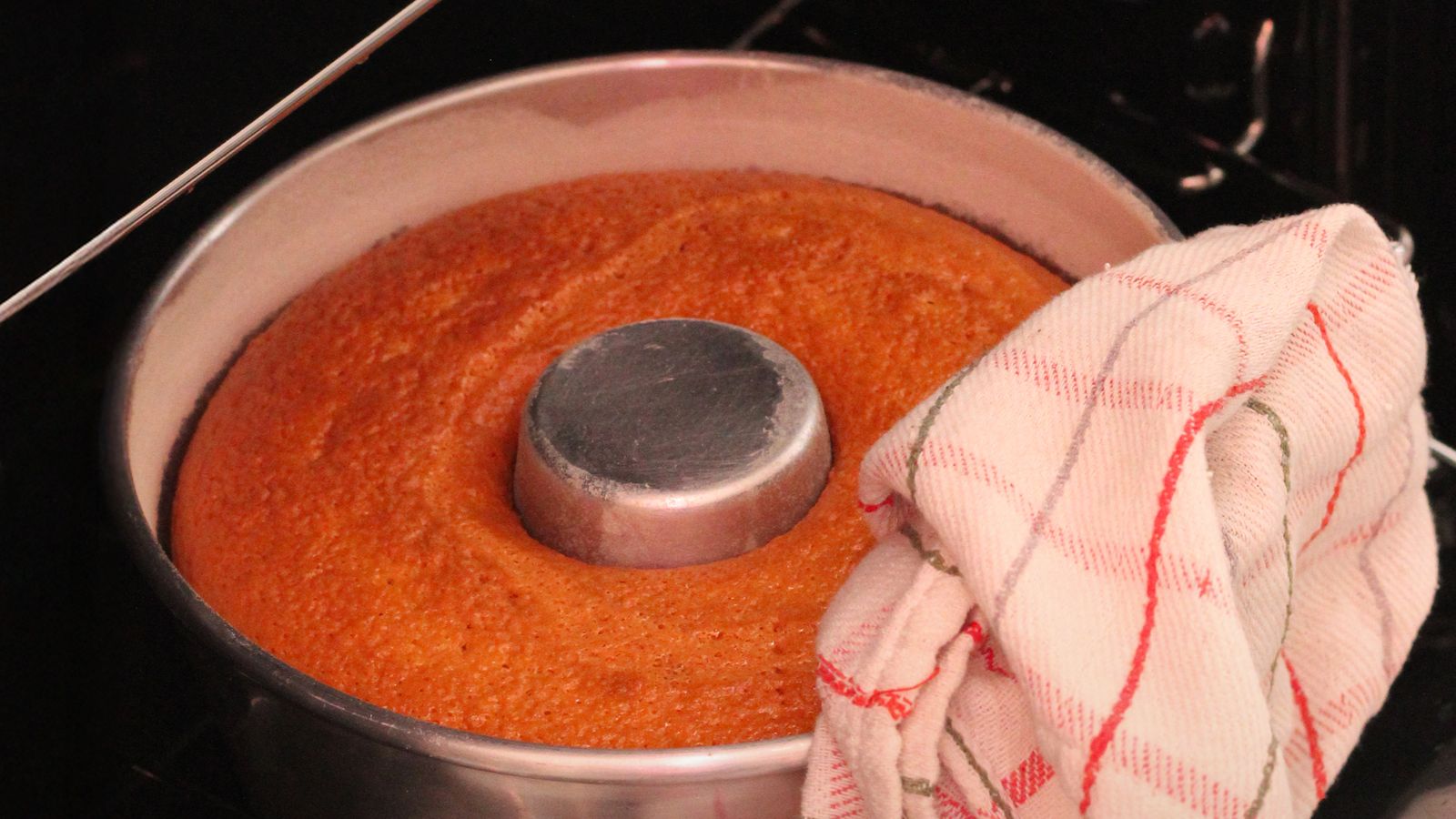 Small loaf pan with baked bread ready for an air fryer accessory drawer