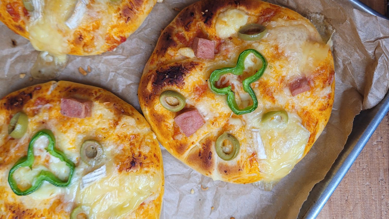 Mini pizza fresh out of the air fryer on a pizza pan