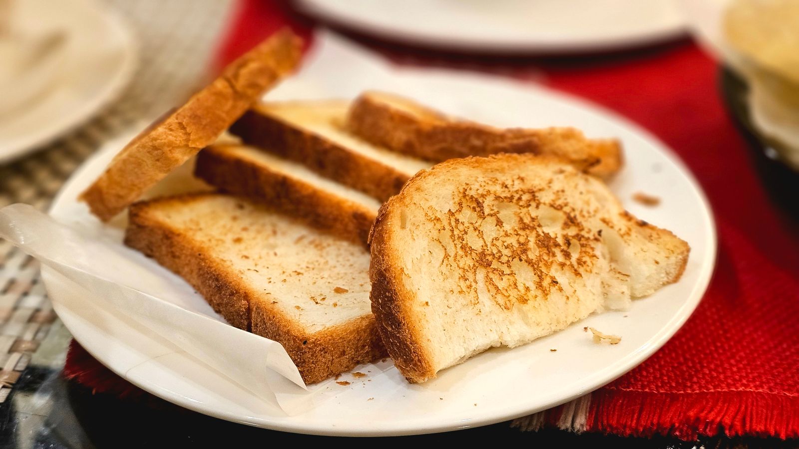 Golden toasted bread slices fresh out of an air fryer toaster oven