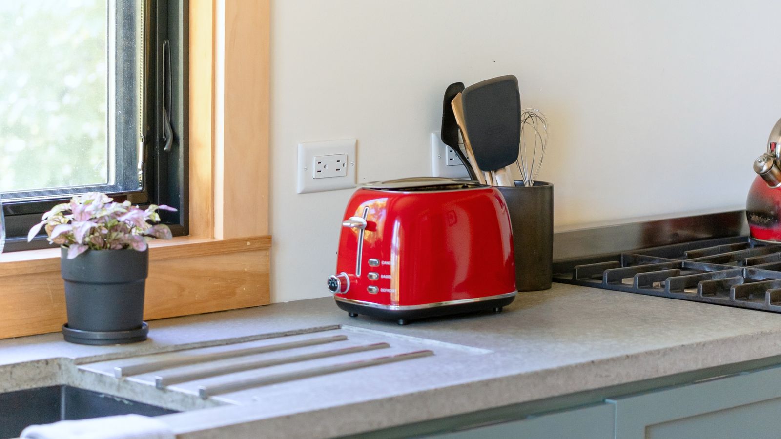 Compact kitchen counter corner with a small toaster and appliances fitted neatly