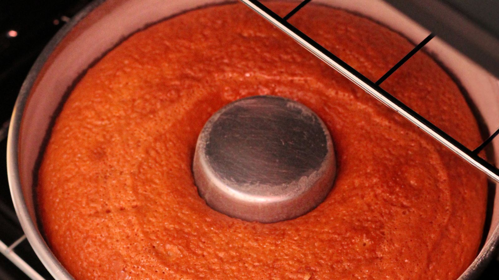 Golden cake baking inside an air fryer basket