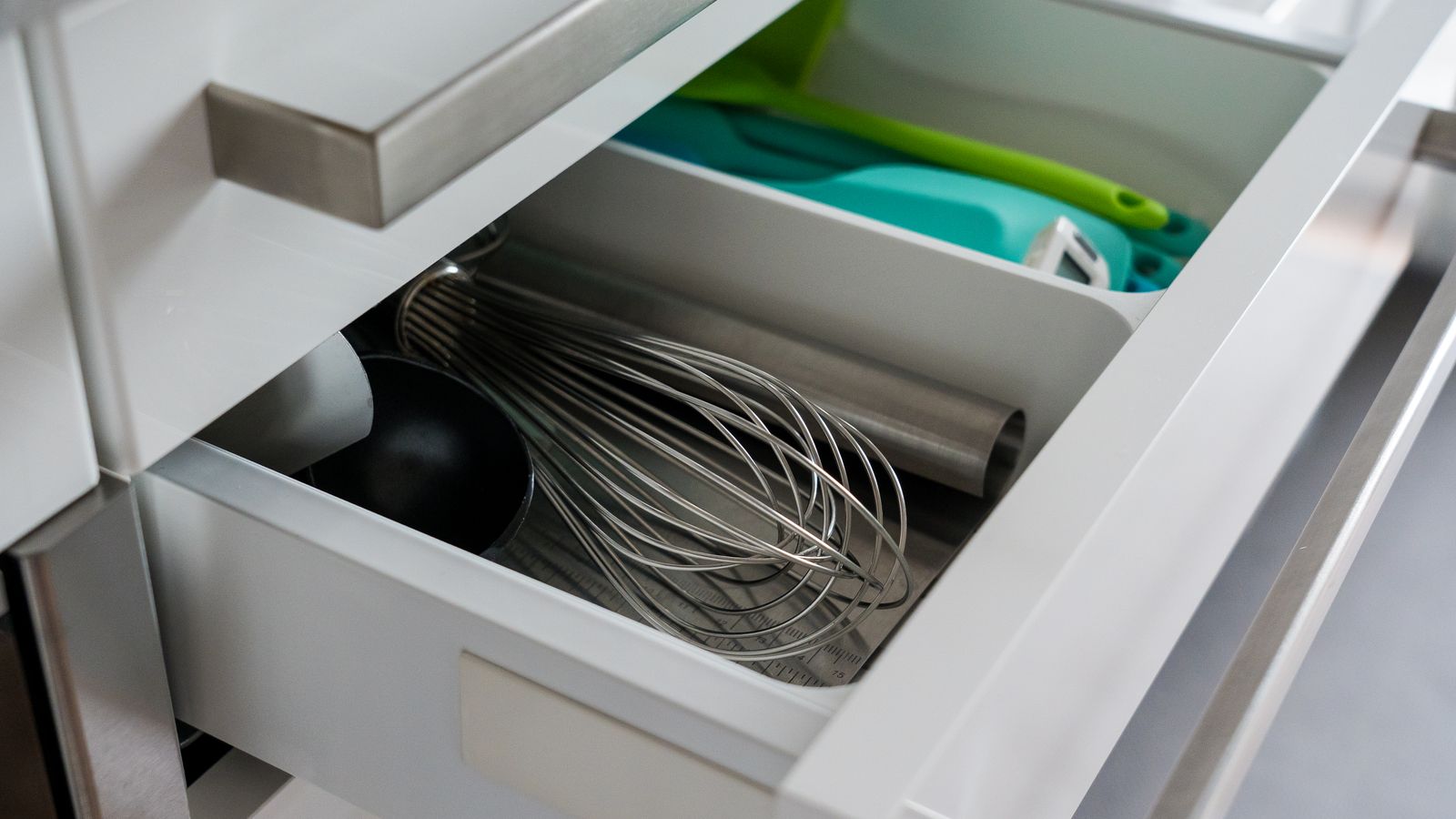 Organized kitchen drawer with minimal air fryer prep tools neatly arranged