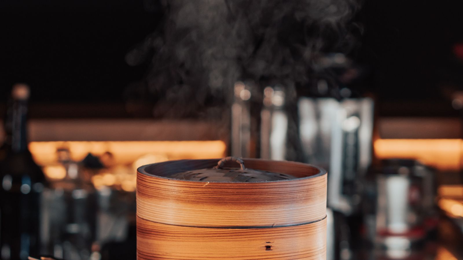 Steam rising from food cooking inside an air fryer with steam-assist function