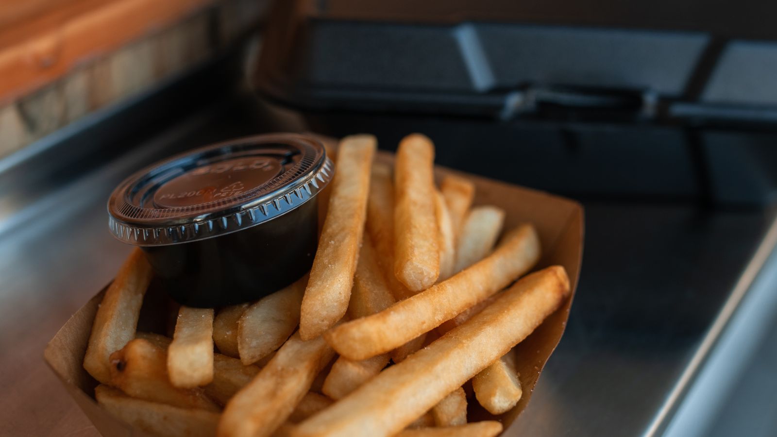Golden crispy French fries fresh out of the air fryer basket