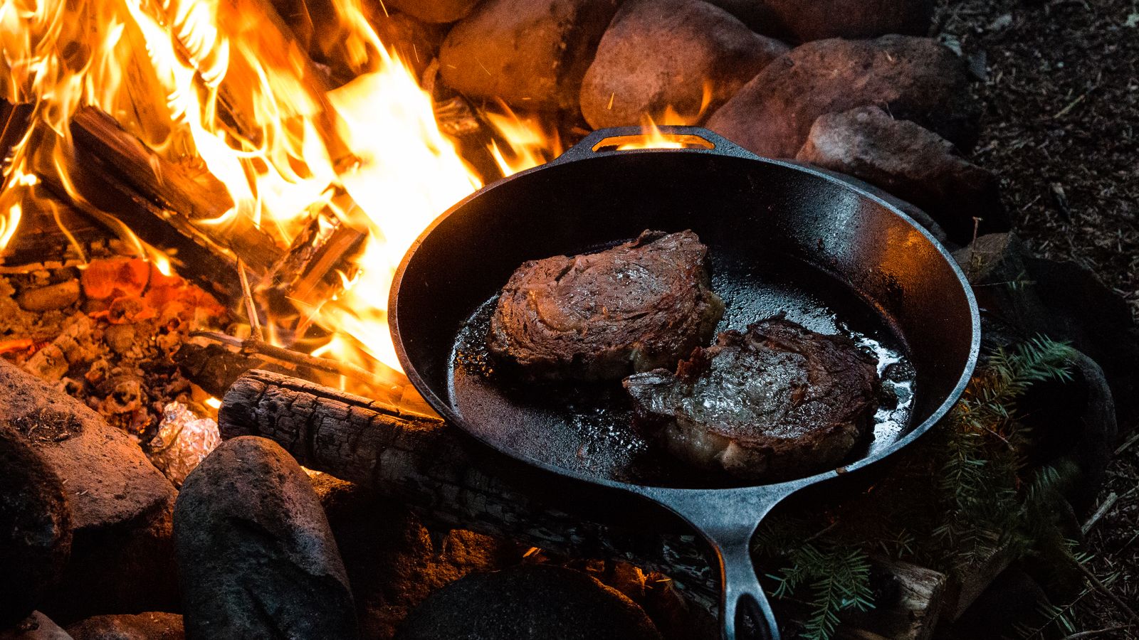 Outdoor cooking setup representing a portable air frying routine while camping