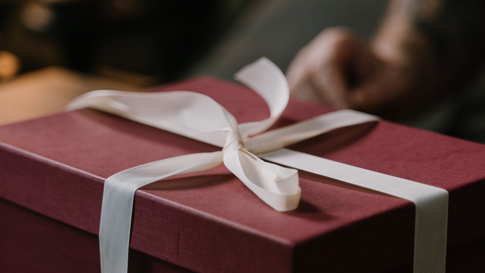 Gift wrapped box with ribbon and tag ready for giving