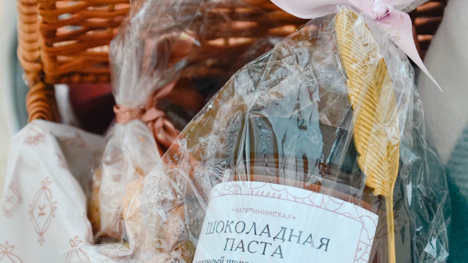 A curated gift basket of home cleaning supplies wrapped and ready to give