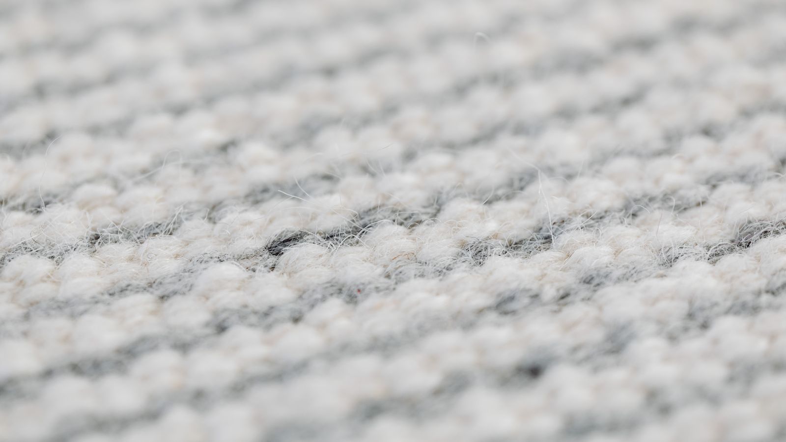 Close-up of a wool area rug texture in a living room