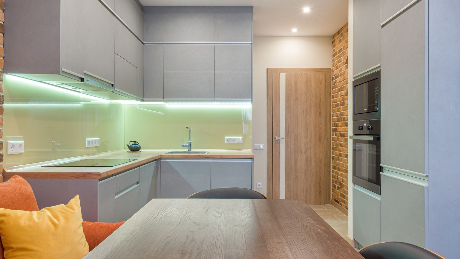 Compact kitchen counter with a small air fryer stored near limited cabinet space