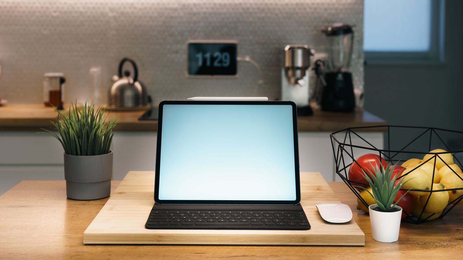 Tablet propped in a kitchen recipe holder on a clean countertop next to an air fryer