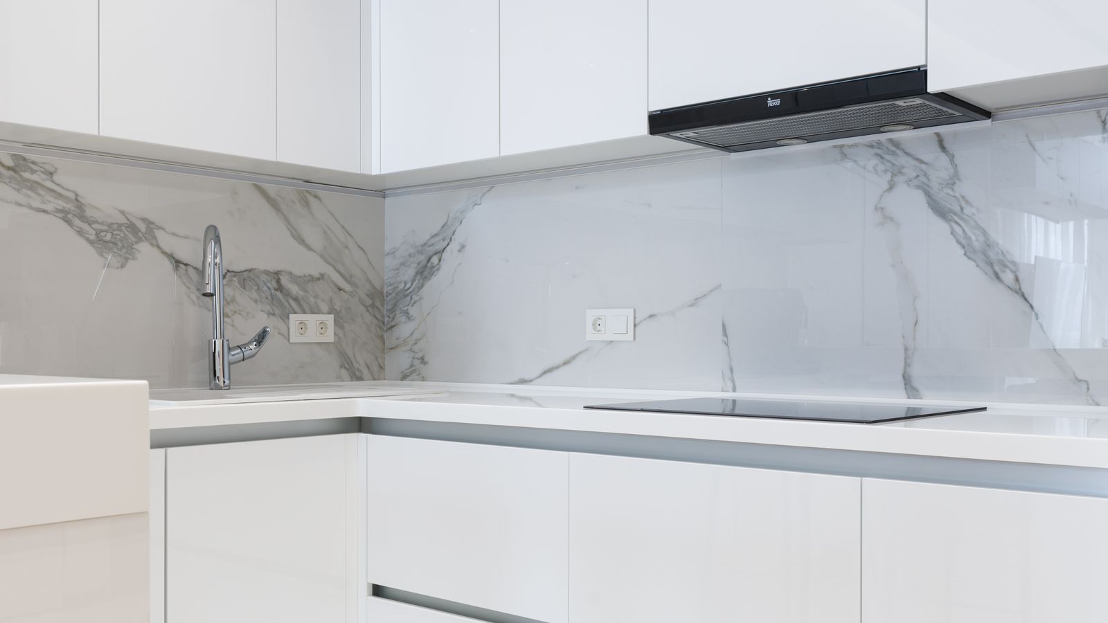 Organized kitchen countertop with matching appliances and tidy cord management