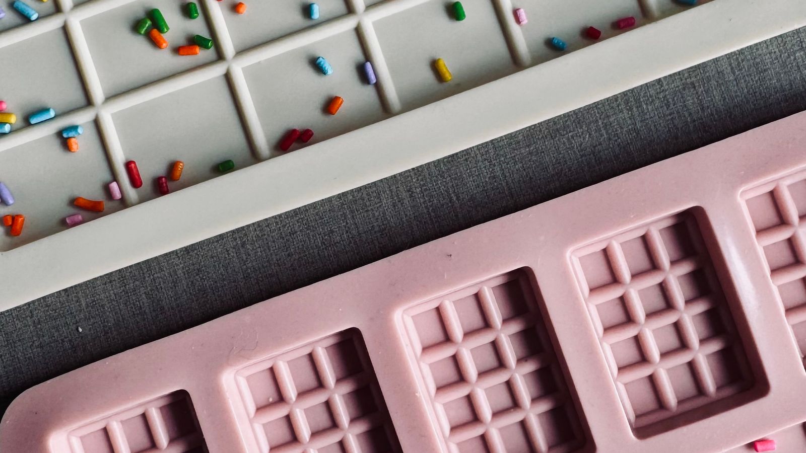 Flexible silicone trivet mat laid flat to line the bottom of a kitchen drawer