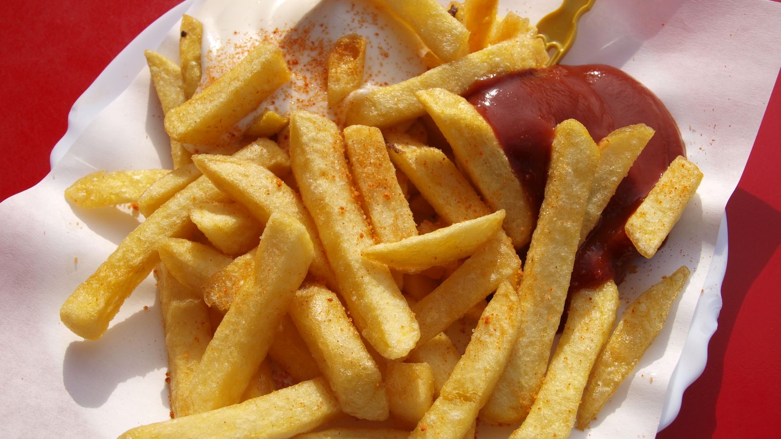 Basket of crispy golden French fries fresh from the air fryer