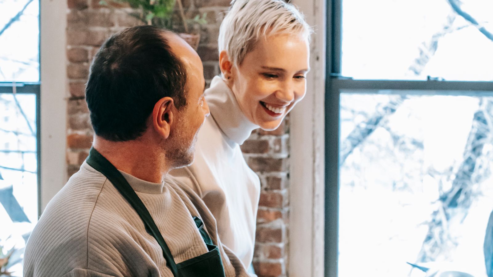 Couple preparing vegetables together at a kitchen counter for an air fryer meal