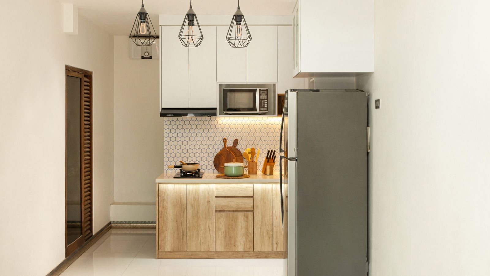 Compact kitchen counter with an air fryer positioned safely away from a walkway