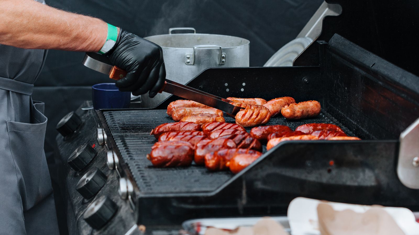 Digital meat thermometer probe inserted into cooked food to check internal temperature