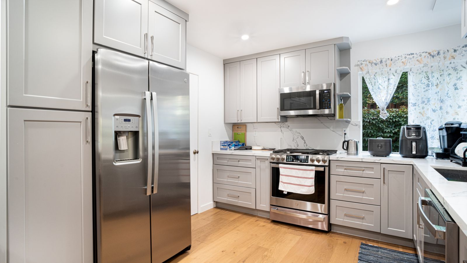 Modern kitchen counter with stainless steel convection oven and air fryer appliances