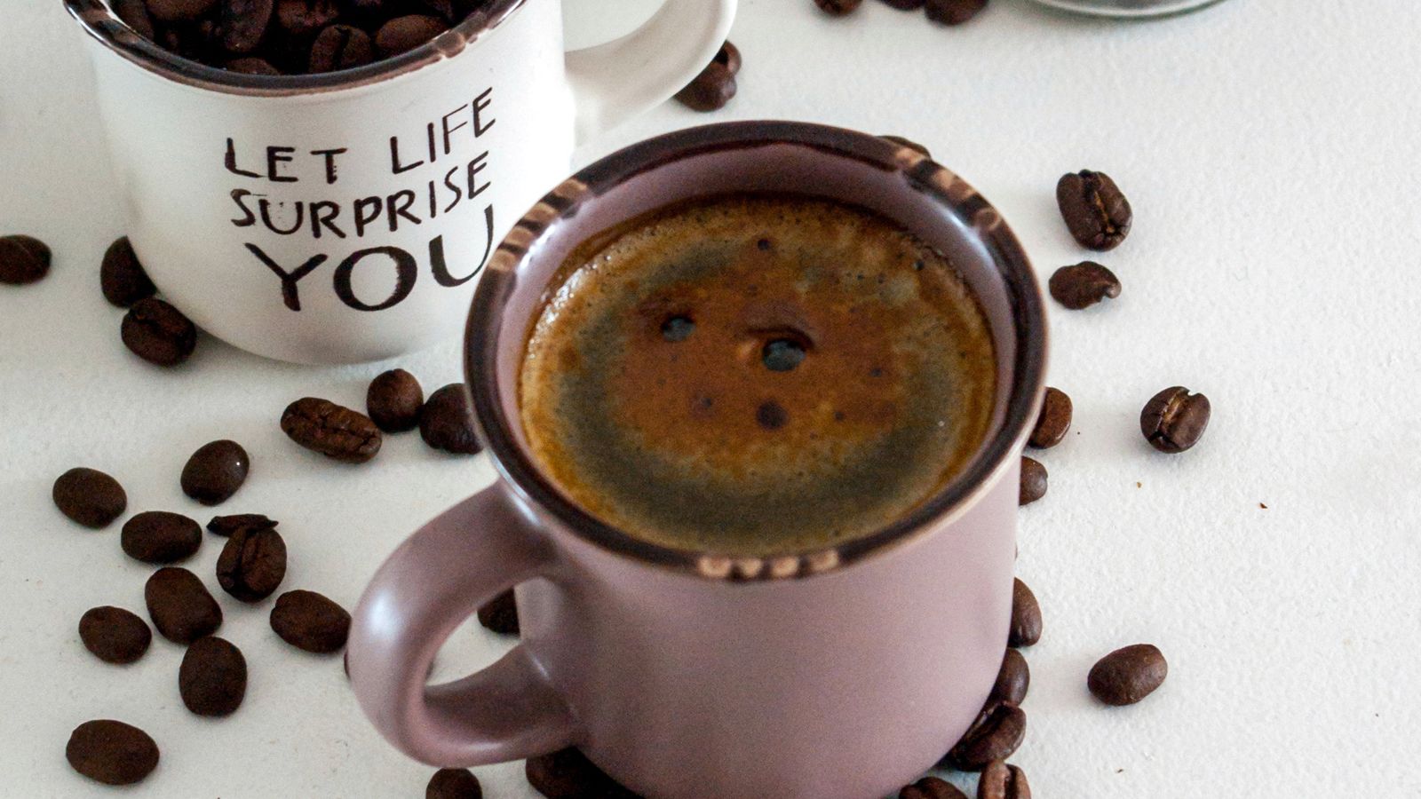 Coffee mug on a warming plate keeping a drink hot on a kitchen counter