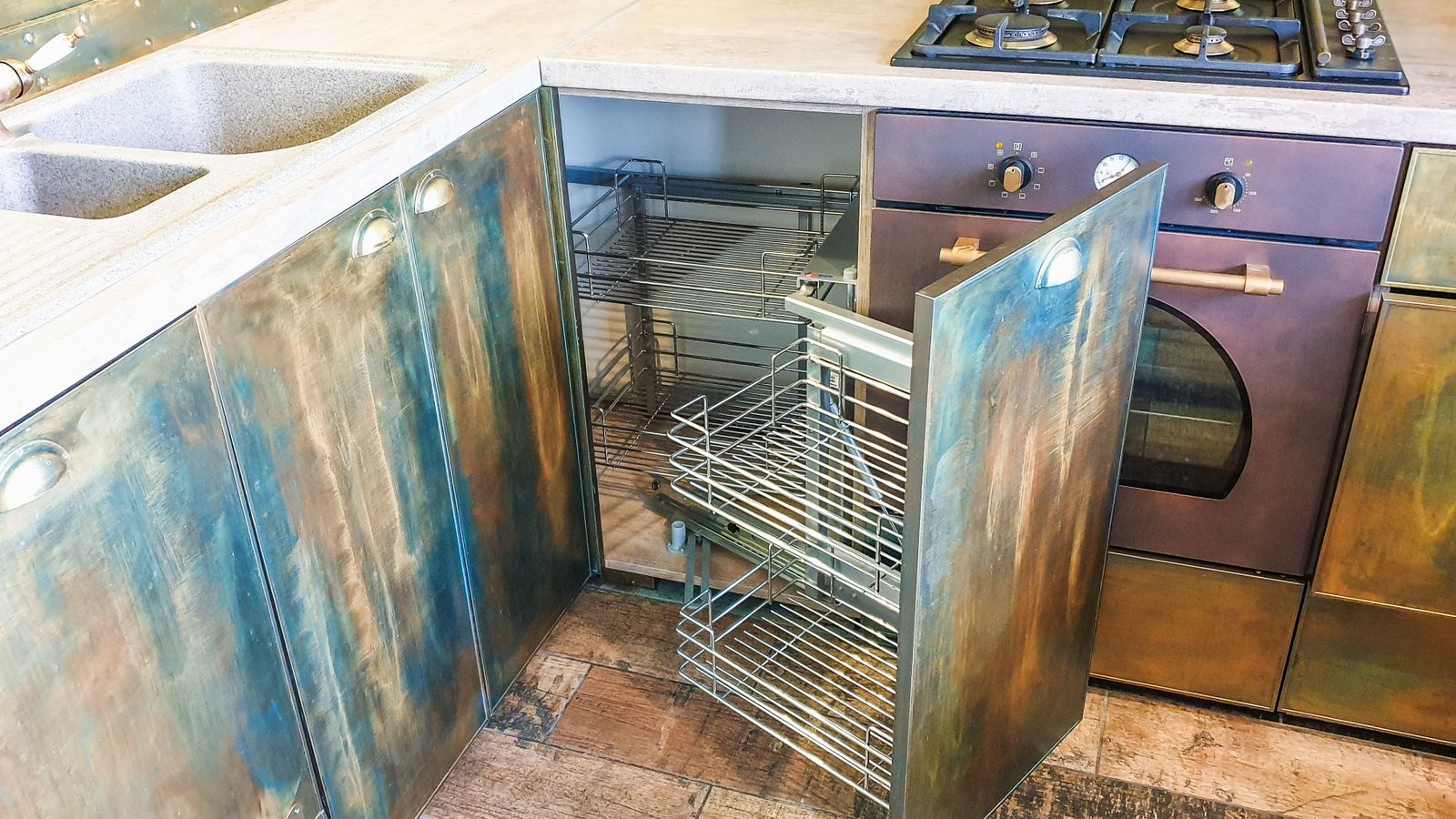 Organized kitchen cabinet with bakeware stacked neatly for storage
