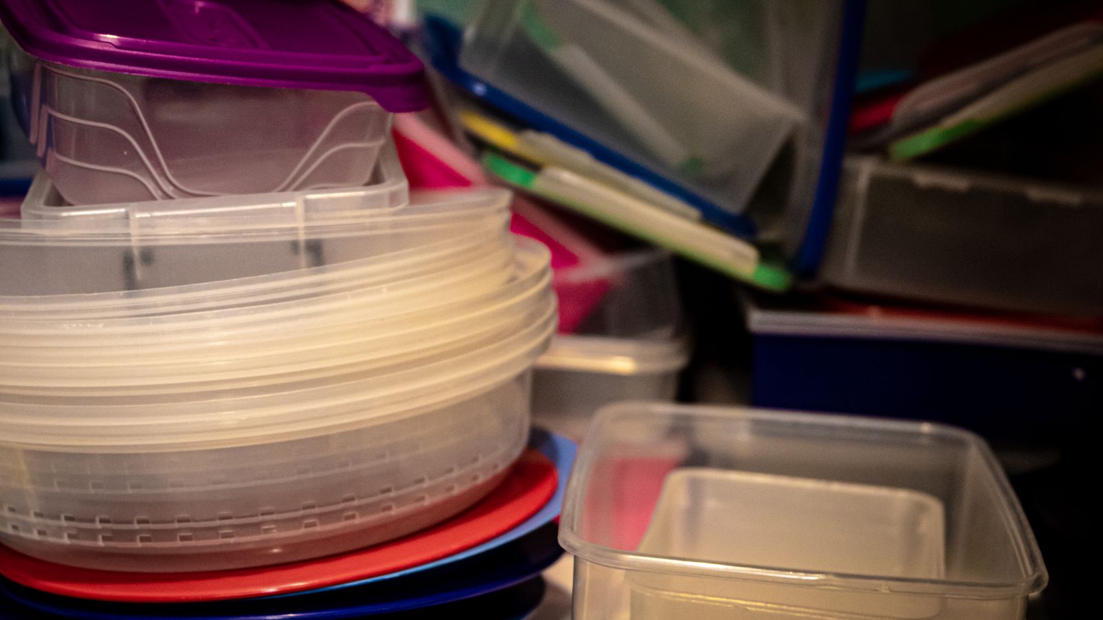 Clean kitchen storage containers and shelving used for organizing air fryer accessories