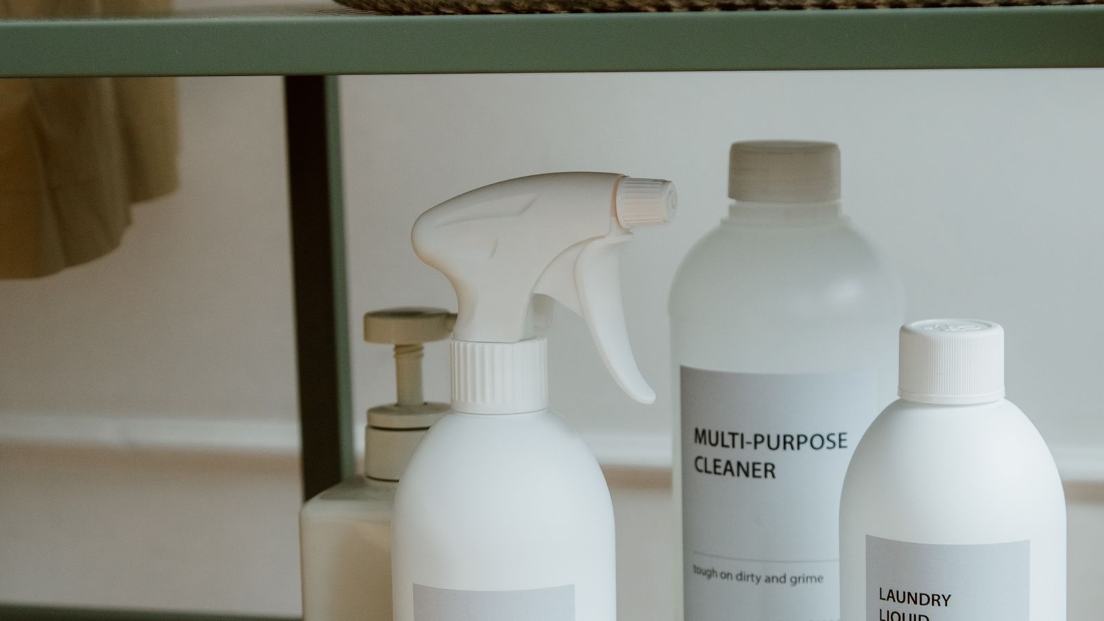 Bottles of carpet cleaning solution organized neatly on a shelf
