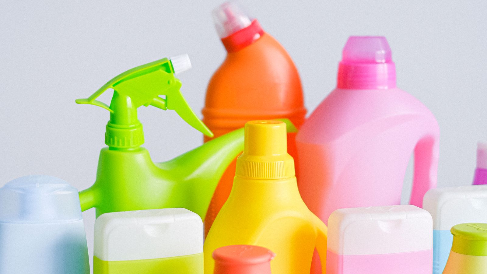 Assorted cleaning product containers organized for household storage