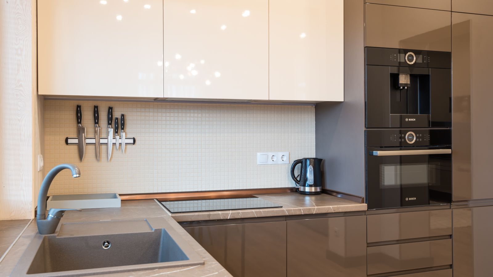 Wall-mounted kitchen appliance shelf holding an air fryer and other small kitchen tools